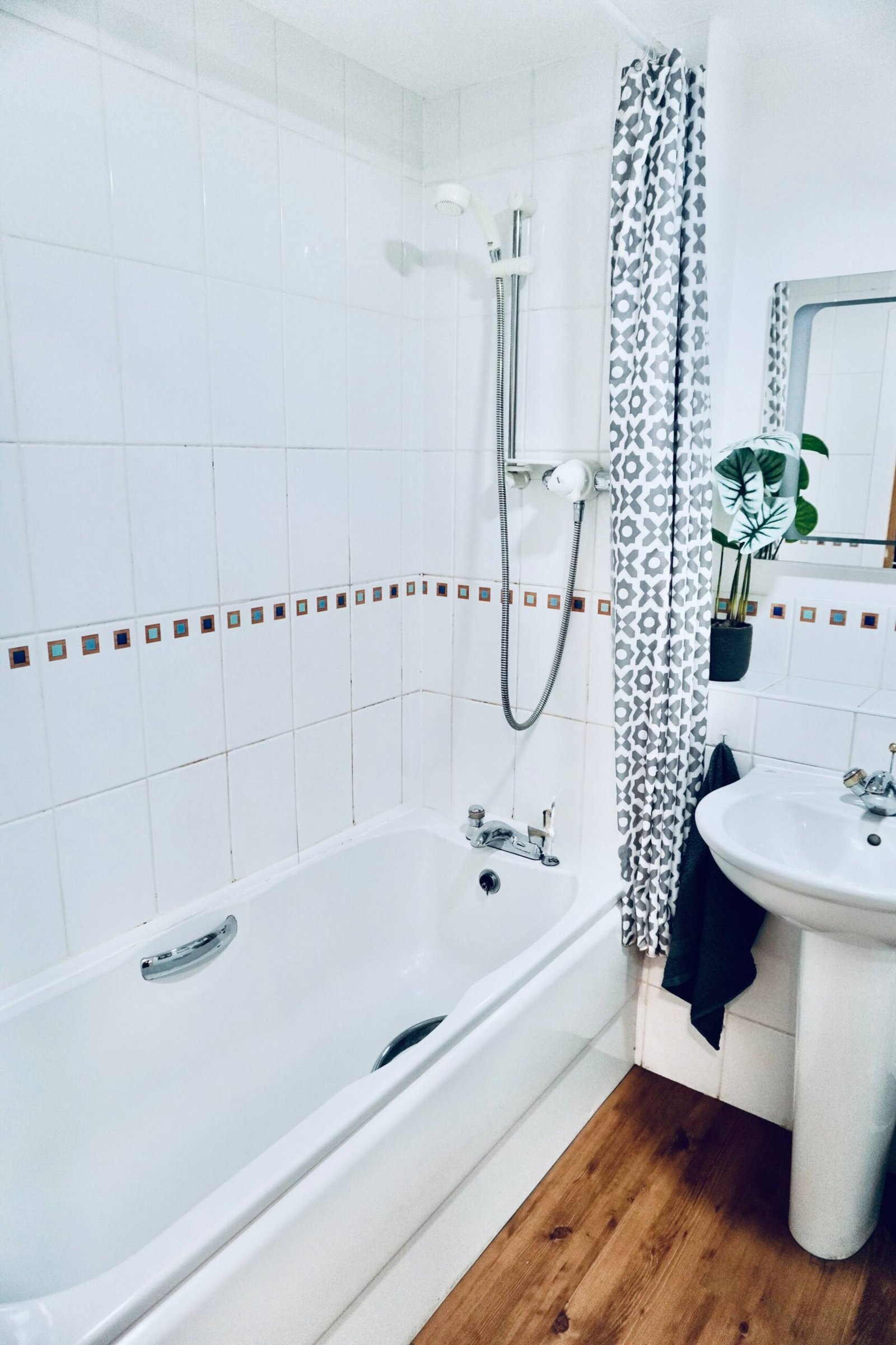 Two bedroom apartment — bathroom with bath and overhead shower